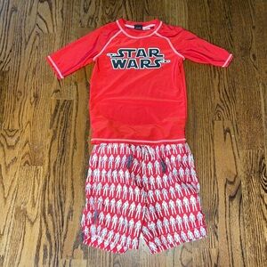 Star Wars rash guard and swim trunks. Size medium top and 6-7 bottoms.